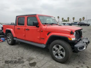 2023 Jeep Gladiator Sport S with VIN 1C6HJTAG4PL547608, listed as a Copart auction lot 52566245 with 8,464 mi miles and Salvage title. Bid and sale history available at DreamBid. Image 4.