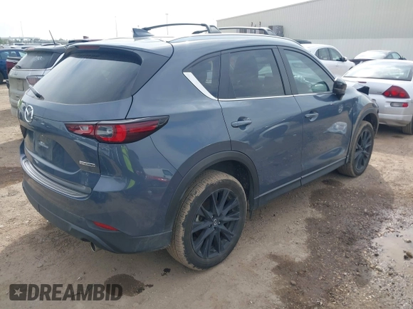 2023 Mazda CX-5 S Carbon Edition z VIN JM3KFBCM6P0288402, wystawiony jako IAAI lot #41682386 z przebiegiem 30 482 mil mil oraz . Historia ofert i sprzedaży dostępna na DreamBid. Obrazek 4.