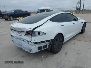 2021 Tesla Model S Plaid z VIN 5YJSA1E64MF452744, wystawiony jako IAAI lot #41375136 z przebiegiem Nie podano mil oraz . Historia ofert i sprzedaży dostępna na DreamBid. Obrazek 4.