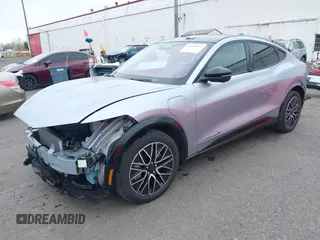 2022 Ford Mustang Mach-E Premium z VIN 3FMTK3SU4NMA04044, wystawiony jako IAAI lot #41839957 z przebiegiem 55 300 mil mil oraz . Historia ofert i sprzedaży dostępna na DreamBid. Obrazek 2.