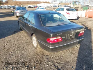 2000 Mercedes-Benz E-Class with VIN WDBJF65J1YB058351, listed as a IAAI auction lot 41834603 with 100,525 mi miles. Bid and sale history available at carsss.com. Image 3.