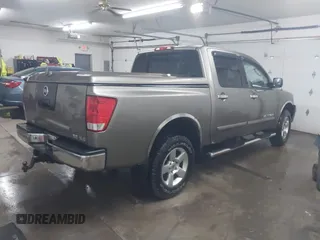 2006 Nissan Titan LE z VIN 1N6BA07B26N572273, wystawiony jako IAAI lot #41252390 z przebiegiem 88 457 mil mil oraz . Historia ofert i sprzedaży dostępna na DreamBid. Obrazek 4.
