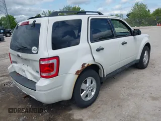 2012 Ford Escape XLT z VIN 1FMCU9DG2CKB18584, wystawiony jako IAAI lot #42469881 z przebiegiem 166 469 mil mil oraz . Historia ofert i sprzedaży dostępna na DreamBid. Obrazek 4.
