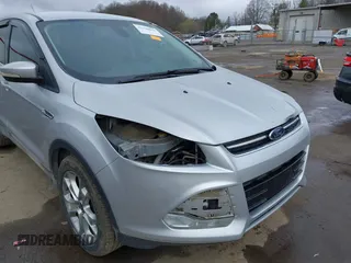 2013 Ford Escape SEL with VIN 1FMCU9H93DUA81448, listed as a IAAI auction lot 41790631 with 176,015 mi miles. Bid and sale history available at carsss.com. Image 6.