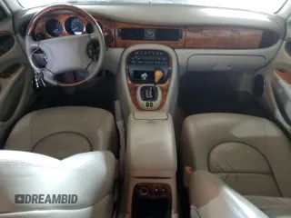 2000 Jaguar XJ with VIN SAJDA25B8YMF04079, listed as a Copart auction lot 50592595 with 131,647 mi miles and Salvage title. Bid and sale history available at DreamBid. Image 8.