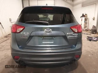 2015 Mazda CX-5 Grand Touring with VIN JM3KE4DY7F0504398, listed as a IAAI auction lot 41698365 with 122,121 mi miles. Bid and sale history available at carsss.com. Image 16.