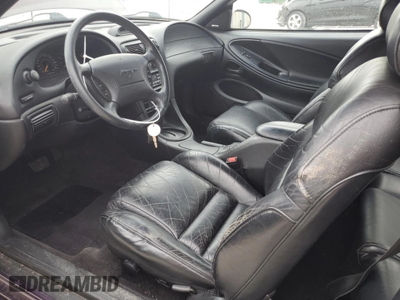 1996 Ford Mustang GT z VIN 1FALP42X8TF196321, wystawiony jako Copart lot #50874885 z przebiegiem 86 945 mil mil oraz Szkoda całkowita • Salvage title. Historia ofert i sprzedaży dostępna na DreamBid. Obrazek 7.