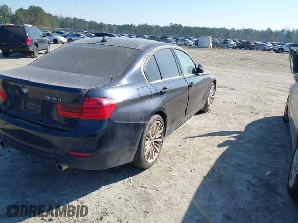 2014 BMW 3 Series 335i with VIN WBA3A9C54EF477943, listed as a IAAI auction lot 41632554 with 102,273 mi miles. Bid and sale history available at carsss.com. Image 4.