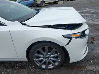 2021 Mazda 3 Preferred z VIN 3MZBPBCL0MM250862, wystawiony jako IAAI lot #42318612 z przebiegiem 86 056 mil mil oraz . Historia ofert i sprzedaży dostępna na DreamBid. Obrazek 19.