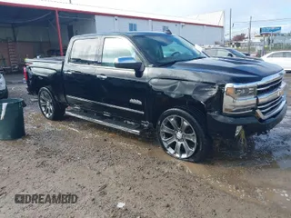 2018 Chevrolet Silverado 1500 High Country with VIN 3GCUKTEJXJG233766, listed as a IAAI auction lot 40808156 with 59,193 mi miles and . Bid and sale history available at DreamBid. Image 1.