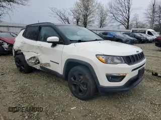 2018 Jeep Compass Latitude with VIN 3C4NJDBB0JT453466, listed as a Copart auction lot 51288935 with 94,886 mi miles and Salvage Title. Bid and sale history available at DreamBid. Image 4.