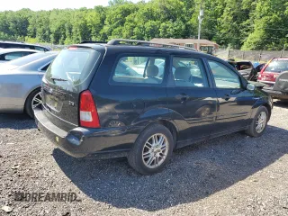 2004 Ford Focus ZTW with VIN 1FAFP35Z84W203676, listed as a Copart auction lot 57272835 with 183,115 mi miles and Salvage title. Bid and sale history available at DreamBid. Image 3.