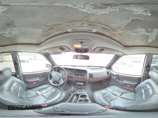 1998 Jeep Grand Cherokee Limited z VIN 1J4GZ78S0WC276411, wystawiony jako Copart lot #78200114 z przebiegiem 220 856 mil mil oraz Szkoda całkowita • Salvage title. Historia ofert i sprzedaży dostępna na DreamBid. Obrazek 13.