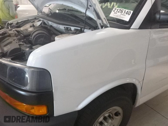 2019 Chevrolet Express Cargo Van with VIN 1GCWGAFG2K1328310, listed as a IAAI auction lot 42136986 with 88,759 mi miles. Bid and sale history available at carsss.com. Image 1.