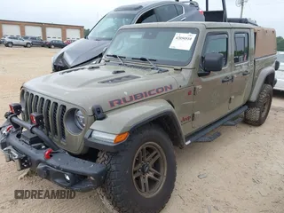 2020 Jeep Gladiator Rubicon z VIN 1C6JJTBG6LL179541, wystawiony jako IAAI lot #42050510 z przebiegiem 52 784 mil mil oraz . Historia ofert i sprzedaży dostępna na DreamBid. Obrazek 2.