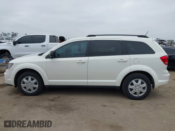 2014 Dodge Journey American Value with VIN 3C4PDCAB8ET141803, listed as a IAAI auction lot 42097292 with 76,339 mi miles and . Bid and sale history available at DreamBid. Image 14.
