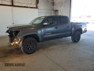 2023 Toyota Tacoma SR z VIN 3TMCZ5AN4PM599664, wystawiony jako Copart lot #57462455 z przebiegiem 65 736 mil mil oraz Szkoda całkowita • Salvage title. Historia ofert i sprzedaży dostępna na DreamBid. Obrazek 1.