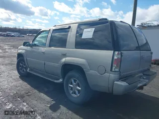 1999 GMC Denali with VIN 1GKEK13R7XR903255, listed as a IAAI auction lot 41496032 with 233,645 mi miles. Bid and sale history available at carsss.com. Image 3.
