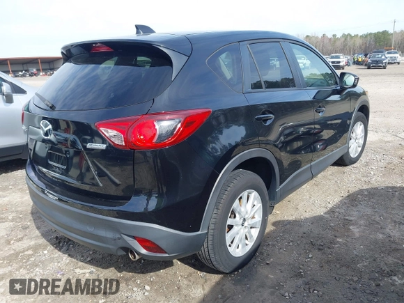 2014 Mazda CX-5 Touring with VIN JM3KE2CY9E0333951, listed as a IAAI auction lot 41825345 with 124,684 mi miles. Bid and sale history available at carsss.com. Image 4.