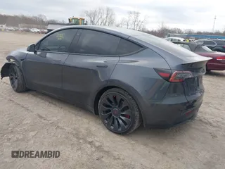 2023 Tesla Model Y Performance with VIN 7SAYGDEF2PF757113, listed as a IAAI auction lot 41881175 with 54,809 mi miles and . Bid and sale history available at DreamBid. Image 3.