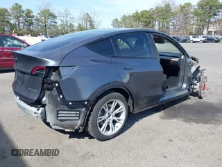 2023 Tesla Model Y Long Range with VIN 7SAYGDEE7PF856985, listed as a IAAI auction lot 42097675 with 13,112 mi miles and . Bid and sale history available at DreamBid. Image 4.