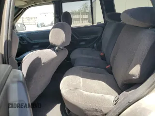 1999 Jeep Grand Cherokee Laredo with VIN 1J4GW58S1XC775877, listed as a Copart auction lot 55639795 with 197,611 mi miles and Salvage title. Bid and sale history available at DreamBid. Image 11.