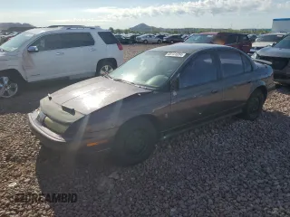 1999 Saturn SL with VIN 1G8ZK527XXZ136922, listed as a Copart auction lot 86704404 with 134,897 mi miles and Salvage Title. Bid and sale history available at carsss.com. Image 1.