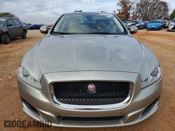2014 Jaguar XJ with VIN SAJWA1CZ5E8V71971, listed as a Copart auction lot 82116114 with 127,164 mi miles and Salvage Title. Bid and sale history available at DreamBid. Image 5.