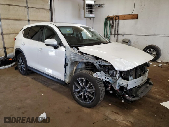 2018 Mazda CX-5 Grand Touring with VIN JM3KFBDM6J0455993, listed as a Copart auction lot 61414275 with 77,570 mi miles and Salvage title. Bid and sale history available at DreamBid. Image 4.