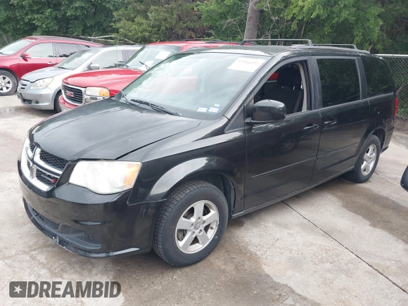2013 Dodge Grand Caravan SXT with VIN 2C4RDGCG0DR552784, listed as a IAAI auction lot 42116395 with 96,917 mi miles and . Bid and sale history available at DreamBid. Image 2.