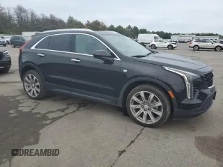 2021 Cadillac XT4 AWD Luxury with VIN 1GYFZBR4XMF014647, listed as a Copart auction lot 63800444 with 49,724 mi miles and Salvage Title. Bid and sale history available at carsss.com. Image 4.
