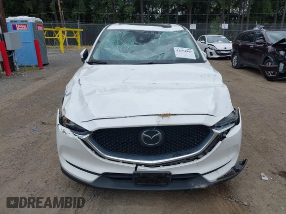 2018 Mazda CX-5 Grand Touring with VIN JM3KFBDM1J0382306, listed as a IAAI auction lot 42554947 with 121,303 mi miles and . Bid and sale history available at DreamBid. Image 12.
