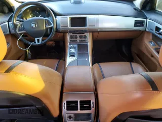 2015 Jaguar XF V6 Portfolio with VIN SAJWA0F76F8U59802, listed as a Copart auction lot 77198104 with 98,859 mi miles and Clean Title. Bid and sale history available at carsss.com. Image 8.