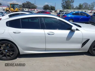 2022 BMW 8 Series M850i z VIN WBAGV8C02NCH87808, wystawiony jako IAAI lot #42255995 z przebiegiem 34 285 mil mil oraz . Historia ofert i sprzedaży dostępna na DreamBid. Obrazek 13.