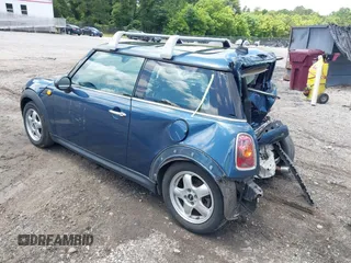 2009 MINI Hardtop with VIN WMWMF33509TU74290, listed as a IAAI auction lot 42538919 with 104,209 mi miles and . Bid and sale history available at DreamBid. Image 3.
