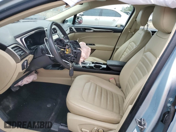 2013 Ford Fusion SE Hybrid z VIN 3FA6P0LU6DR174719, wystawiony jako Copart lot #62877715 z przebiegiem 52 884 mil mil oraz Szkoda całkowita • Salvage title. Historia ofert i sprzedaży dostępna na DreamBid. Obrazek 7.