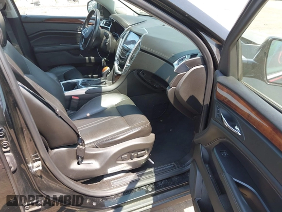 2015 Cadillac SRX Premium Collection with VIN 3GYFNDE38FS569129, listed as a IAAI auction lot 42485655 with 96,717 mi miles and . Bid and sale history available at DreamBid. Image 5.
