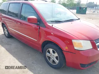 2010 Dodge Grand Caravan SXT with VIN 2D4RN5D17AR145958, listed as a IAAI auction lot 42125450 with 229,790 mi miles and . Bid and sale history available at DreamBid. Image 6.