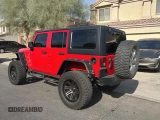 2018 Jeep Wrangler JK Unlimited Sport S with VIN 1C4BJWDG7JL828871, listed as a Copart auction lot 87530425 with 60,958 mi miles and Clean Title. Bid and sale history available at carsss.com. Image 3.