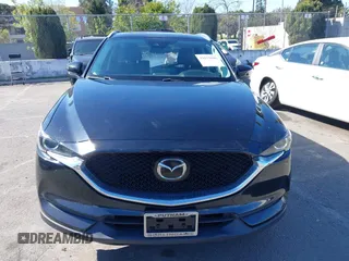 2021 Mazda CX-5 Touring with VIN JM3KFACM2M0339349, listed as a IAAI auction lot 41651005 with 53,792 mi miles. Bid and sale history available at carsss.com. Image 12.