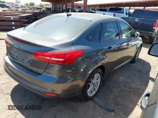 2018 Ford Focus SE with VIN 1FADP3FE6JL270910, listed as a IAAI auction lot 42130371 with 121,240 mi miles. Bid and sale history available at carsss.com. Image 4.