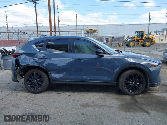 2023 Mazda CX-5 S Carbon Edition z VIN JM3KFBCM5P0179543, wystawiony jako IAAI lot #41950082 z przebiegiem 31 573 mil mil oraz . Historia ofert i sprzedaży dostępna na DreamBid. Obrazek 14.