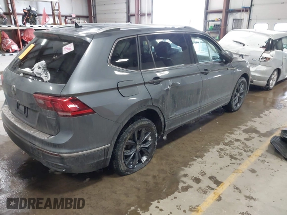 2023 Volkswagen Tiguan SE with VIN 3VVMB7AX5PM013447, listed as a IAAI auction lot 41615200 with 66,259 mi miles and . Bid and sale history available at DreamBid. Image 4.