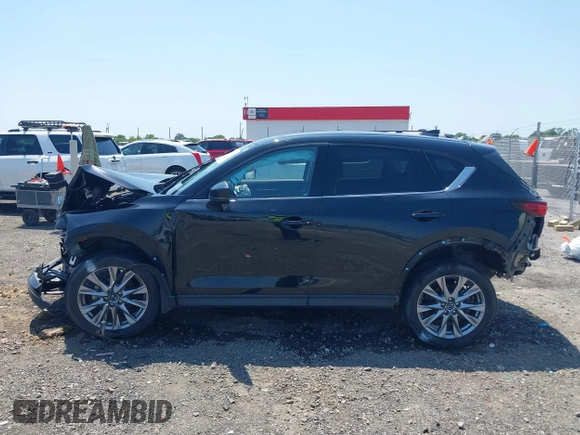 2020 Mazda CX-5 Grand Touring with VIN JM3KFADM9L1837183, listed as a IAAI auction lot 42340628 with 81,975 mi miles and . Bid and sale history available at DreamBid. Image 14.