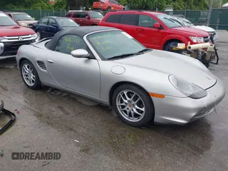 2003 Porsche Boxster z VIN WP0CA29873U622672, wystawiony jako IAAI lot #42365548 z przebiegiem 28 619 mil mil oraz . Historia ofert i sprzedaży dostępna na DreamBid. Obrazek 1.