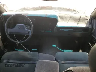 1991 Dodge Dakota z VIN 1B7GL23Y3MS309507, wystawiony jako Copart lot #58079905 z przebiegiem 90 932 mil mil oraz Szkoda całkowita • Salvage title. Historia ofert i sprzedaży dostępna na DreamBid. Obrazek 8.