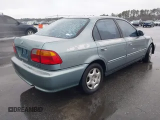 1999 Honda Civic EX z VIN 1HGEJ8643XL010821, wystawiony jako IAAI lot #41602036 z przebiegiem 165 139 mil mil oraz . Historia ofert i sprzedaży dostępna na DreamBid. Obrazek 4.