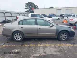 2002 Nissan Altima SL z VIN 1N4AL11D92C294136, wystawiony jako IAAI lot #42342860 z przebiegiem 220 080 mil mil oraz . Historia ofert i sprzedaży dostępna na DreamBid. Obrazek 13.