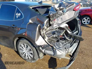 2019 Toyota Camry Hybrid LE z VIN 4T1B31HK4KU516123, wystawiony jako IAAI lot #41733410 z przebiegiem 98 273 mil mil oraz . Historia ofert i sprzedaży dostępna na DreamBid. Obrazek 17.