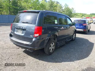 2013 Dodge Grand Caravan SXT with VIN 2C4RDGCG4DR636798, listed as a IAAI auction lot 42240550 with 96,100 mi miles and . Bid and sale history available at DreamBid. Image 4.